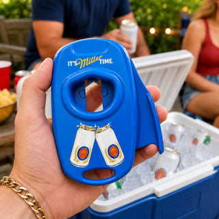 Can-top opener held beside a cooler at an outdoor gathering