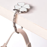 HangElegance - Foldable, Stylish, and Secure Handbag Hanger