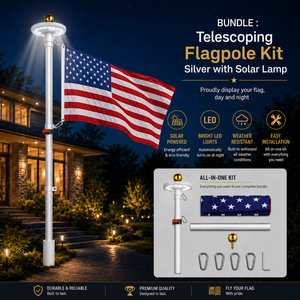 Telescoping flagpole kit with solar lamp and American flag in front of a house at night.