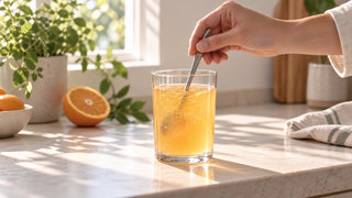 Mixing an orange citrus Umipear botanical drink