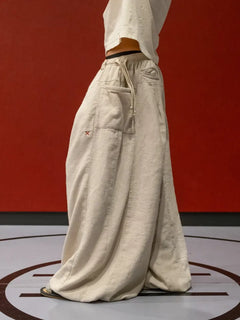 FLAX PLEATED WIDE-LEG PANTS
