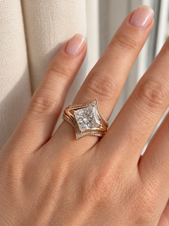 Original close view of the princess-cut center and crown-inspired enhancer