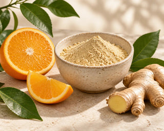 Botanical powder with orange, ginger and green leaves