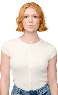 Person wearing a white top and blue jeans with a plain background