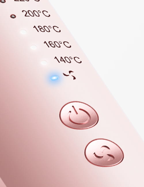 Close-up of a kitchen appliance control panel with temperature settings and power button.