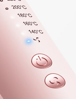 Close-up of a kitchen appliance control panel with temperature settings and power button.