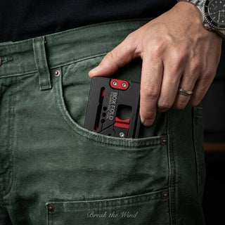 Person carrying the compact BOXFOLD EDC tool in a trouser pocket