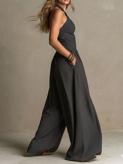 StripeFlow – Crisscross Halter Pinstripe Wide-Leg Jumpsuit