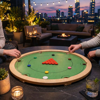 Players lining up the striker and chips on the green rotating game board