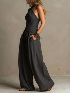 StripeFlow – Crisscross Halter Pinstripe Wide-Leg Jumpsuit