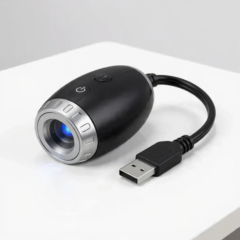 StarVeil AuraDrift Light matte black body with USB cable on white background, compact dreamy star ceiling light design